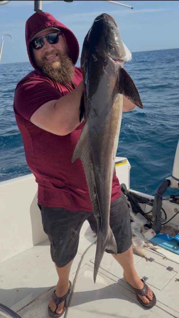 Beast Coast Fishing Charters Man holding large cobia caught fishing